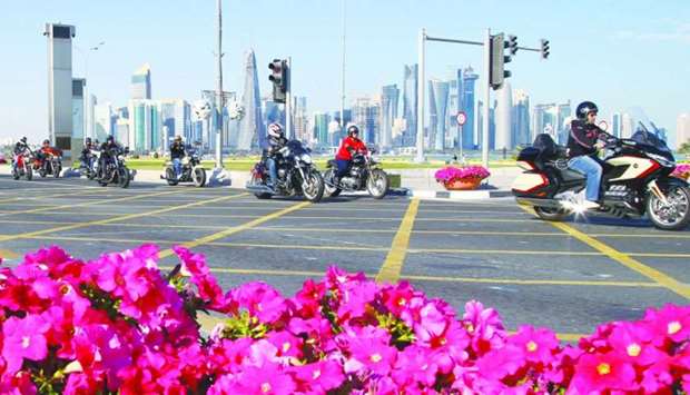 Bikers pass through the Doha Corniche during the parade Fridday. PICTURE: Jayan Orma