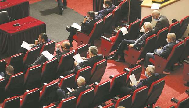 Lebanese members of parliament attend a legislative session yesterday.