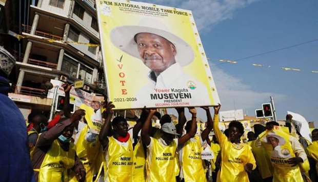 Polling agents from the National Resistance Movement (NRM) party celebrate the victory of Uganda's President Yoweri Museveni in the concluded general elections in Kampala, Uganda