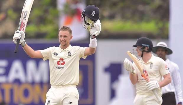 Englandu2019s Joe Root (left) celebrates after reaching his double century during the first Test against Sri Lanka in Galle yesterday. (SLC)