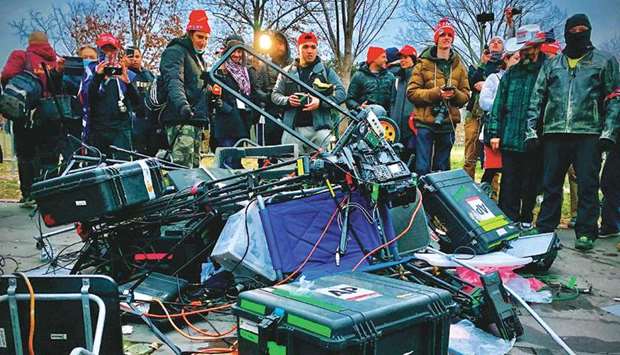 CONTEMPT FOR RULE OF LAW AND VALUES: Supporters of US President Donald Trump stand next to media equipment they destroyed during a protest on January 6 outside the Capitol in Washington, DC. Demonstrators breeched security and entered the Capitol as Congress debated the 2020 presidential election Electoral Vote Certification. (AFP)