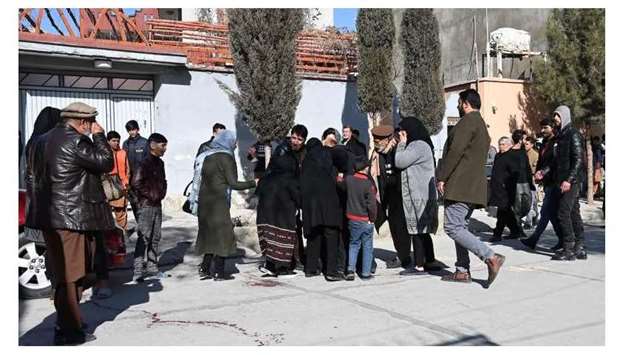 Relatives of the victims arrive at the site following gunmen shot dead two Afghan women judges working for the Supreme Court, in Kabul