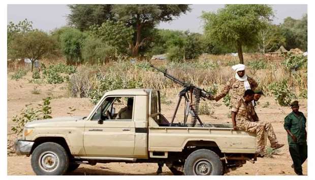 In this file photo taken on April 2, 2016, A convoy of Sudanese security forces deploy during a rally in al-Geneina, the capital of the West Darfur state.