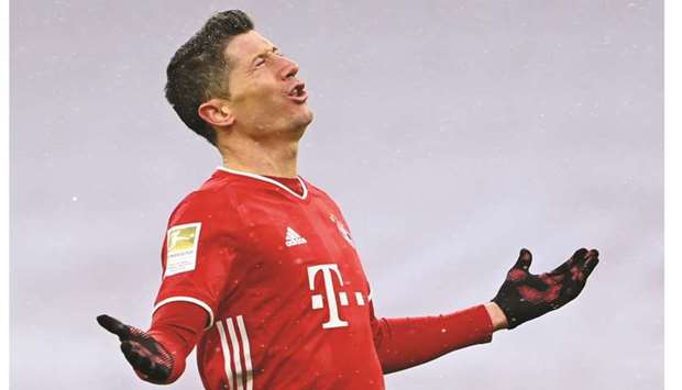Bayern Munichu2019s Robert Lewandowski celebrate after scoring against Freiburg yesterday. (Reuters)