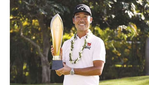 Kevin Na of the United States celebrates with the trophy after winning the Sony Open in Hawaii at the Waialae Country Club in Honolulu, Hawaii. (Getty Images/AFP)