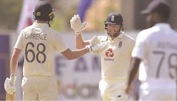 Englandu2019s Jonny Bairstow (right) and Dan Lawrence celebrate after the former scored the winning runs in the first Test against Sri Lanka in Galle yesterday. (Cricket Sri Lanka)