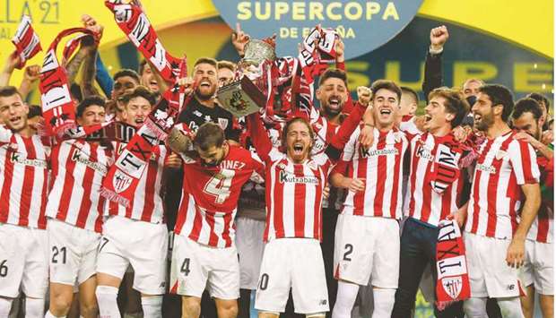 Athletic Bilbao players celebrate after winning the Spanish Super Cup at La Cartuja stadium in Seville on Sunday night. (AFP)