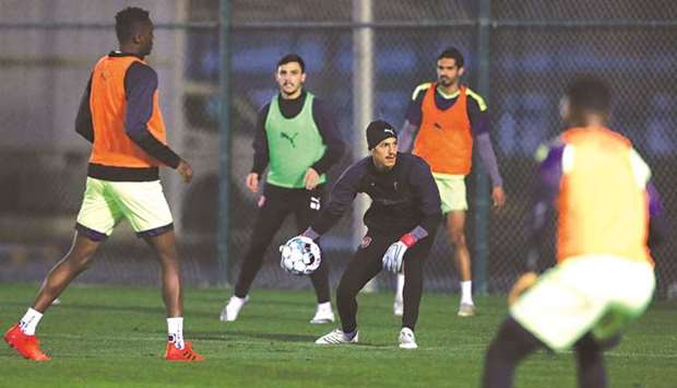 Al Duhail players train yesterday on the eve of their QNB Stars League match against Qatar SC.