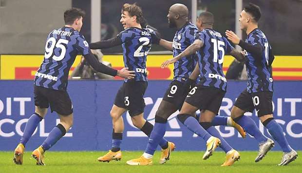 Inter Milanu2019s Nicolo Barella (second left) celebrates with teammates after scoring against Juventus in the Serie A at the San Siro in Milan. (Reuters)