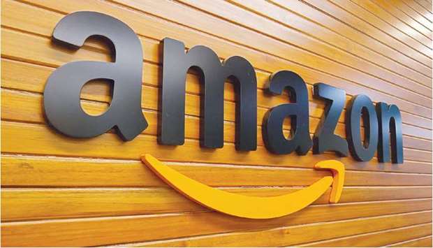 The logo of Amazon is pictured inside the companyu2019s office in Bengaluru (file). India is considering revising its foreign investment rules for e-commerce, three sources and a government spokesman told Reuters, a move that could compel players, including Amazon.com Inc, to restructure their ties with some major sellers.