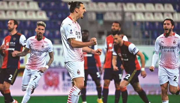 AC Milanu2019s Zlatan Ibrahimovic (centre) celebrates after scoring during the Italian Serie A match against Cagliari at the Sardegna Arena in Cagliari, Italy. (AFP)