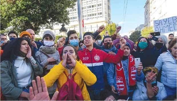 Tunisian protesters shout slogans during an anti-government demonstration in the capital Tunis, yesterday.