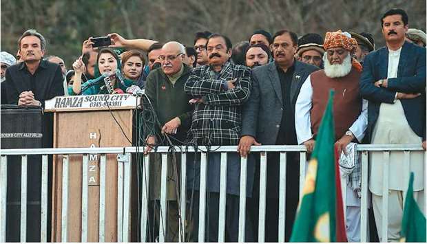 Maryam Nawaz addresses a PDM rally with other leaders in front of the election commission in Islamabad.
