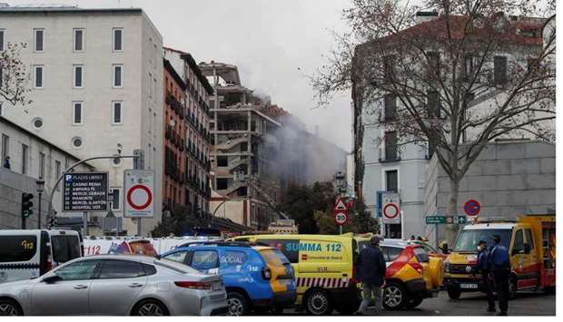Fire fighters work after an explosion in Madrid downtown, Spain.