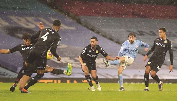 Manchester Cityu2019s Bernardo Silva (second right) scores against Aston Villa in the Premier League at the Etihad Stadium in Manchester yesterday. (Reuters)