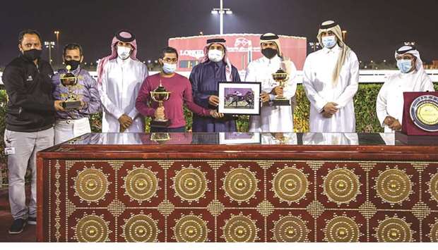 Al Gannas Society Chairman Ali bin Khatam al-Mehshadi (fourth from right), and Qatar and Asian Equestrian Federations President and QREC vice-chairman Hamad Abdulrahman al-Attiyah (second from right) with the winners of the Marmi Cup after Al Shaqab Racingu2019s Lauded won the feature race at Al Rayyan Park yesterday. PICTURES: Juhaim
