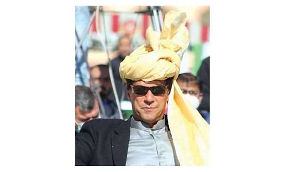 CONFIDENT: Prime Minister Imran Khan wearing a traditional headgear at the Kamyaab Jawan Programme (Youth Entrepreneurship Scheme) cheque distribution ceremony in South Waziristan yesterday.