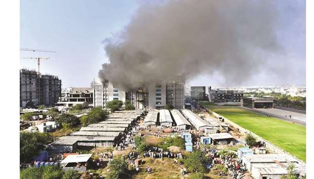 Smoke billows after a fire breaks out inside the complex of the Serum Institute of India, in Pune yesterday.