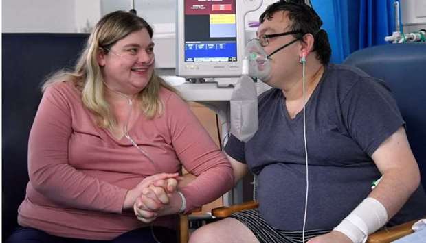 Elizabeth Kerr, 31, and Simon O'Brien, 36, embrace each other in a Covid-19 ward, days after they married in an ICU (Intensive Care Unit) when both had become critically ill with the coronavirus disease, and were uncertain of their chances of surviving, in Milton Keynes University Hospital, Milton Keynes, Britain, on January 20