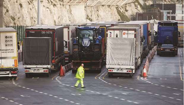 An employee directs haulage trucks as they enter the Port of Dover. In the euro area, supplier delivery times rose the most since the data started being collected in 1997, with the exception of last April when factories closed worldwide, and input costs rose at the fastest pace in two years.