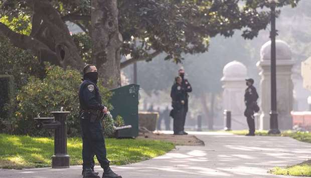 Members of the California Highway Patrol (CHP) wearing protective masks stand outside the State Capitol building in Sacramento. Elon Musk thinks regulators have grown u201ccomplacentu201d and u201centitledu201d about the stateu2019s world-class tech companies.