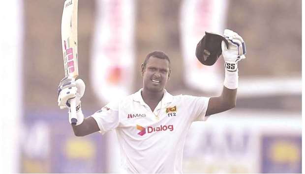 Sri Lankau2019s Angelo Mathews celebrates his century against England on the first day of the second Test in Galle yesterday. (Cricket Sri Lanka)