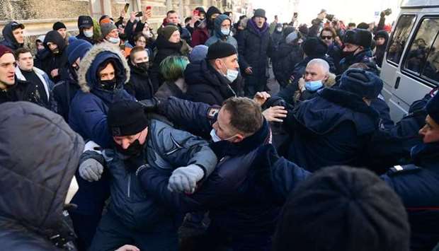 Demonstrators clash with police during a rally in support of jailed opposition leader Alexei Navalny in the far eastern city of Vladivostok