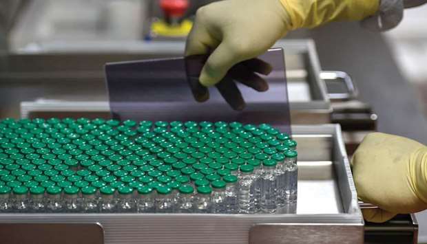 Vials of Covishield, AstraZeneca-Oxfordu2019s Covid-19 vaccine, are pictured inside a lab where they are being manufactured at Indiau2019s Serum Institute in Pune on January 22. Even before the pandemic, the Indian firm was a world leader in vaccines, producing 1.5bn doses a year and inoculating two out of three children in 170 countries against diseases such as polio, mumps, meningitis and measles.