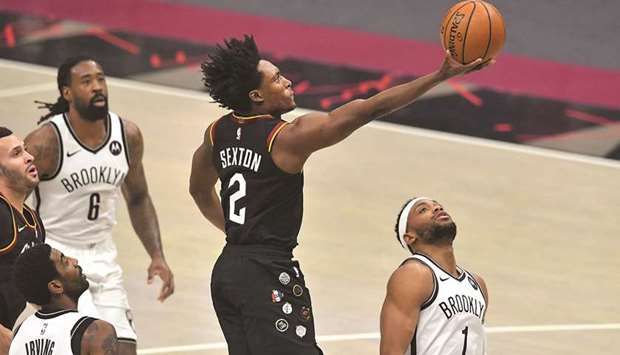 Collin Sexton (second from right) of the Cleveland Cavaliers shoots over Bruce Brown (right) of the Brooklyn Nets during the first quarter of the NBA game at Rocket Mortgage Fieldhouse in Cleveland, Ohio, United States, on Friday. (AFP)