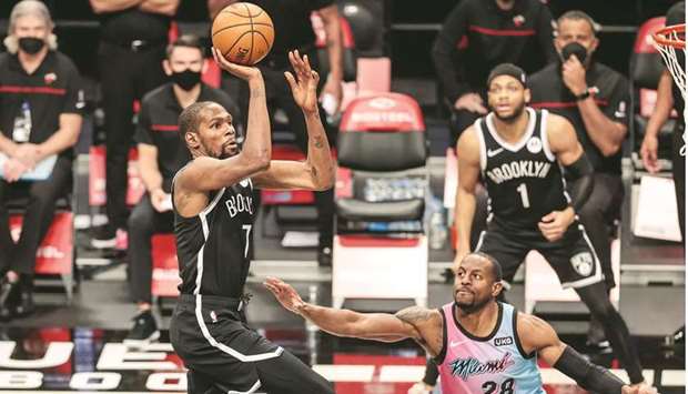 Brooklyn Nets forward Kevin Durant shoots the ball against Miami Heat forward Andre Iguodala during the second half of their NBA game at Barclays Center in Brooklyn, New York.  PICTURE: USA TODAY Sports and Getty Images