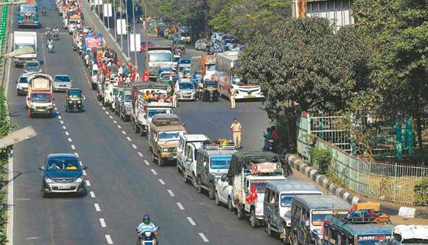 Vehicles carrying farmers cross a state highway during a rally to Mumbai in support of the ongoing farmers protest against the central governmentu2019s recent agricultural reforms, at Bhiwandi in Thane district of Maharashtra yesterday.