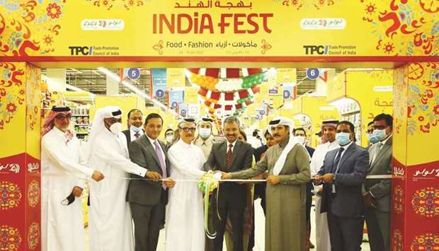 Indian ambassador Dr Deepak Mittal leads the ribbon-cutting ceremony in the presence of Dr Mohamed Althaf, director of LuLu Group, and other dignitaries during the launch of u2018India Fest 2021u2019 at LuLu Hypermarket, Al Gharafa yesterday.