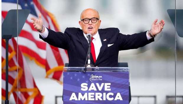 President Donald Trump's personal lawyer Rudy Giuliani gestures as he speaks as Trump supporters gather by the White House ahead of his speech to contest the certification by the US Congress of the results of the 2020 US presidential election in Washington, on January 6