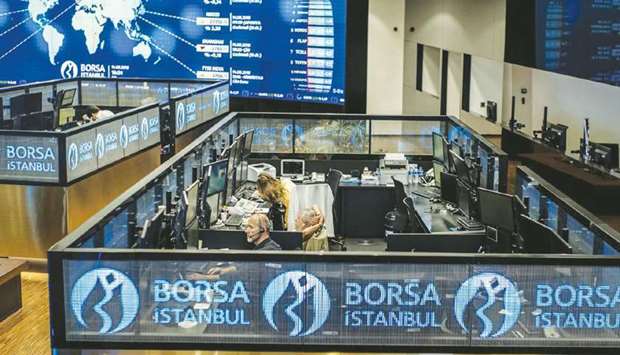 Employees work in booths at the Borsa Istanbul. UNCTADu2019s 2020 Global FDI report has mentioned QIAu2019s announced acquisition of a 10% stake in the Turkish stock exchange.