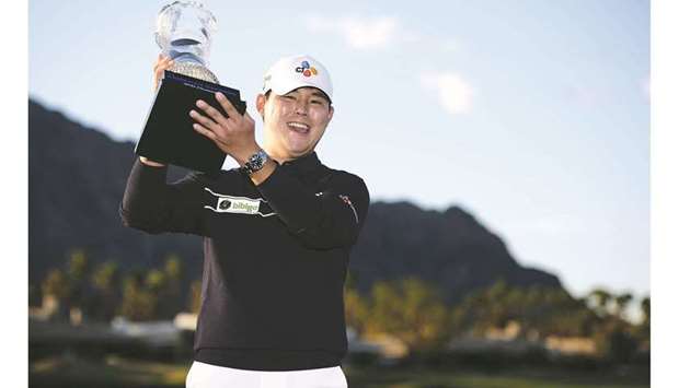 Si Woo Kim poses with the winneru2019s trophy after the final round of The American Express golf tournament at PGA West Peter Dye Stadium Course in La Quinta, California, USA. (USA TODAY Sports)