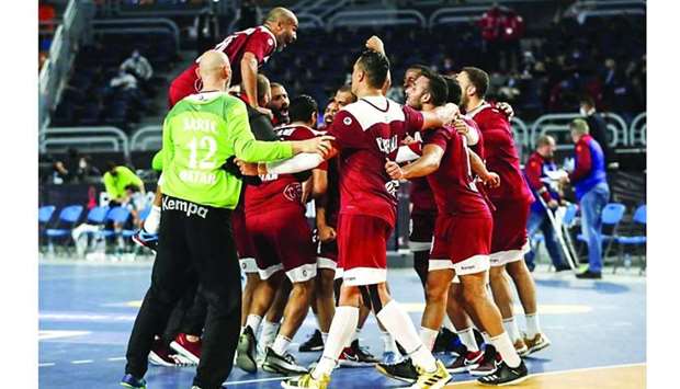 Qatar players celebrate after their win over Argentina during the 2021 World Handball Championship at the Cairo Stadium Sports Hall in the Egyptian capital Monday. PICTURES: Noushad Thekkayil