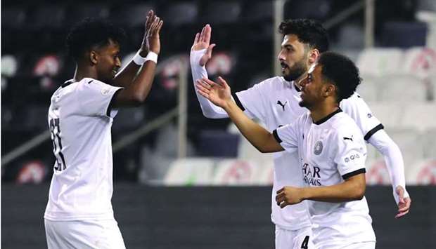 Al Sadd's Youssef Abdel Razaq (left) celebrates after scoring agianst Muaither in the last 16 match of the Amir Cup at the Jassim Bin Hamad Stadium