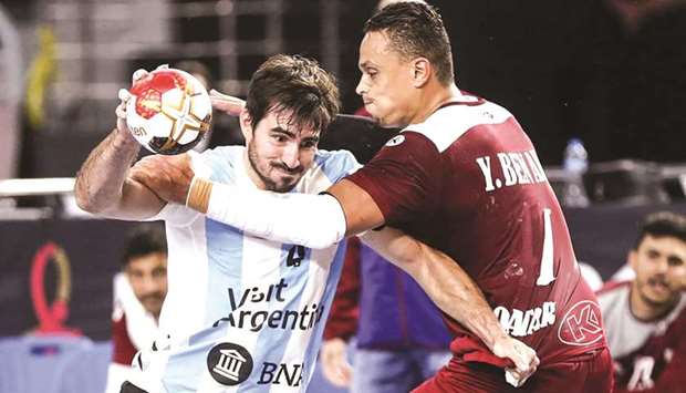 Qataru2019s Youssef Benali (right) in action against Argentina during the IHF Menu2019s Handball World Championship on Monday.