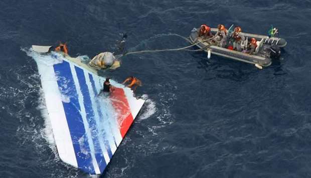 Divers recovering a huge part of the rudder of the Air France A330 aircraft, flight number 0447 from Rio to Paris, that crashed on June 1, 2009 while in midflight over the Atlantic ocean  File handout picture released  by the Brazilian Navy on June 8, 2009