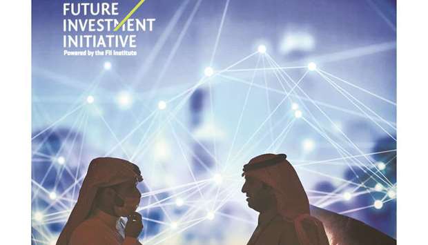 Delegates speak together as they attend the fourth edition of the Future Investment Initiative (FII) conference at the capital Riyadhu2019s Ritz-Carlton hotel yesterday. Only 200 of around 8,000 registered delegates are attending the event in-person, organisers said.