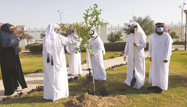 Officials attend a tree-planting event at Kahramaa Awareness Park.
