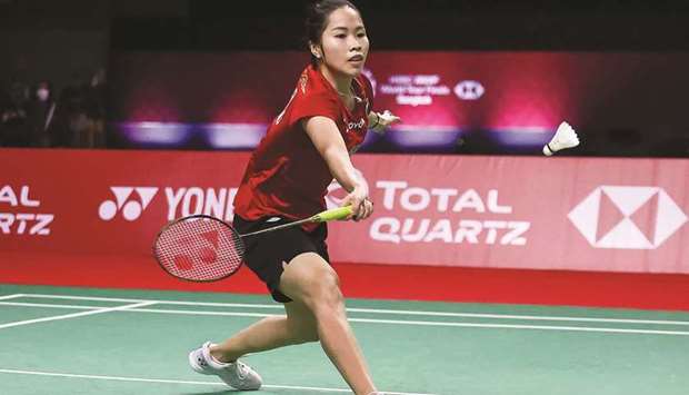 Thailandu2019s Ratchanok Intanon hitting a shot against Indiau2019s PV Sindhu (inset) during their World Tour Finals match in Bangkok. (AFP)