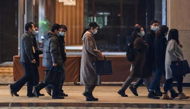 Chinese officials arrive for meetings with the World Health Organization (WHO) team investigating the origins of the Covid-19 pandemic at the Hilton Wuhan Optics Valley Hotel in Wuhan, Chinau2019s central Hubei
