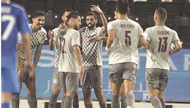 Al Saddu2019s Rodrigo Tabata (third left) celebrates with teammates after scoring against Al Kharaitiyat in the QNB Stars League yesterday.