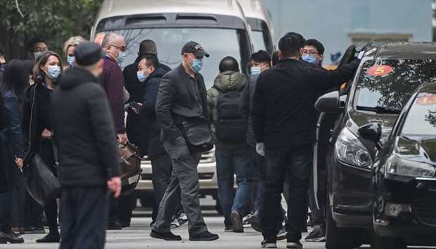 Peter Daszak (C) and other members of the World Health Organization (WHO) team investigating the origins of the Covid-19 pandemic leave the Wuhan Jinyintan Hospital in Wuhan, Chinau2019s central Hubei province