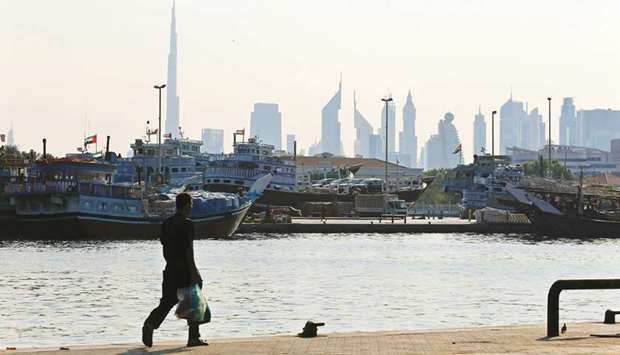 A man walks at Dubai creek in Dubai (file). After declining 3.5% in the first quarter of 2020, Dubai property prices have shown signs of stabilising.