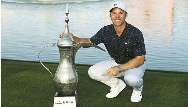 Paul Casey poses with his Dubai Desert Classic Trophy after his four-shot victory yesterday.
