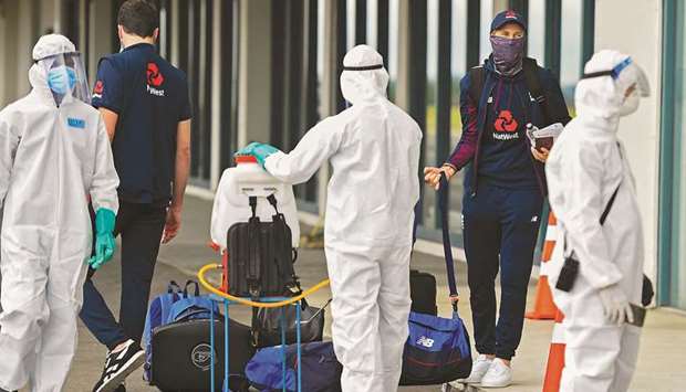 Englandu2019s captain Joe Root (2R) arrives at the Rajapaksa international airport in Mattala yesterday, as Englandu2019s cricket team returned to Sri Lanka to play two Tests abandoned in March due to the Covid-19 coronavirus pandemic.