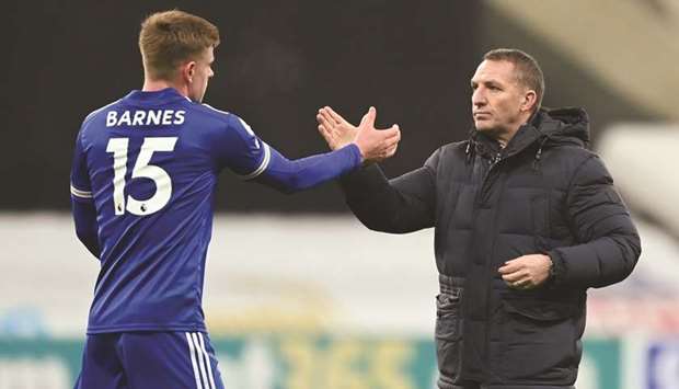 Leicester City manager Brendan Rodgers (right) celebrates with Harvey Barnes after their English Premier League match against Newcastle United at the St Jamesu2019 Park in Newcastle, Britain, on Sunday. (Reuters)