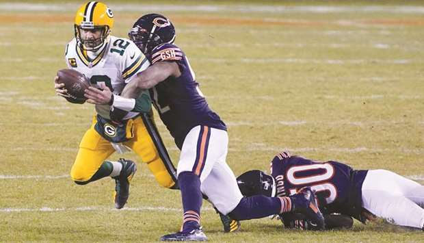 Chicago Bears outside linebacker Khalil Mack (centre) sacks Green Bay Packers quarterback Aaron Rodgers (left) during the third quarter at the Soldier Field. (USA TODAY Sports)